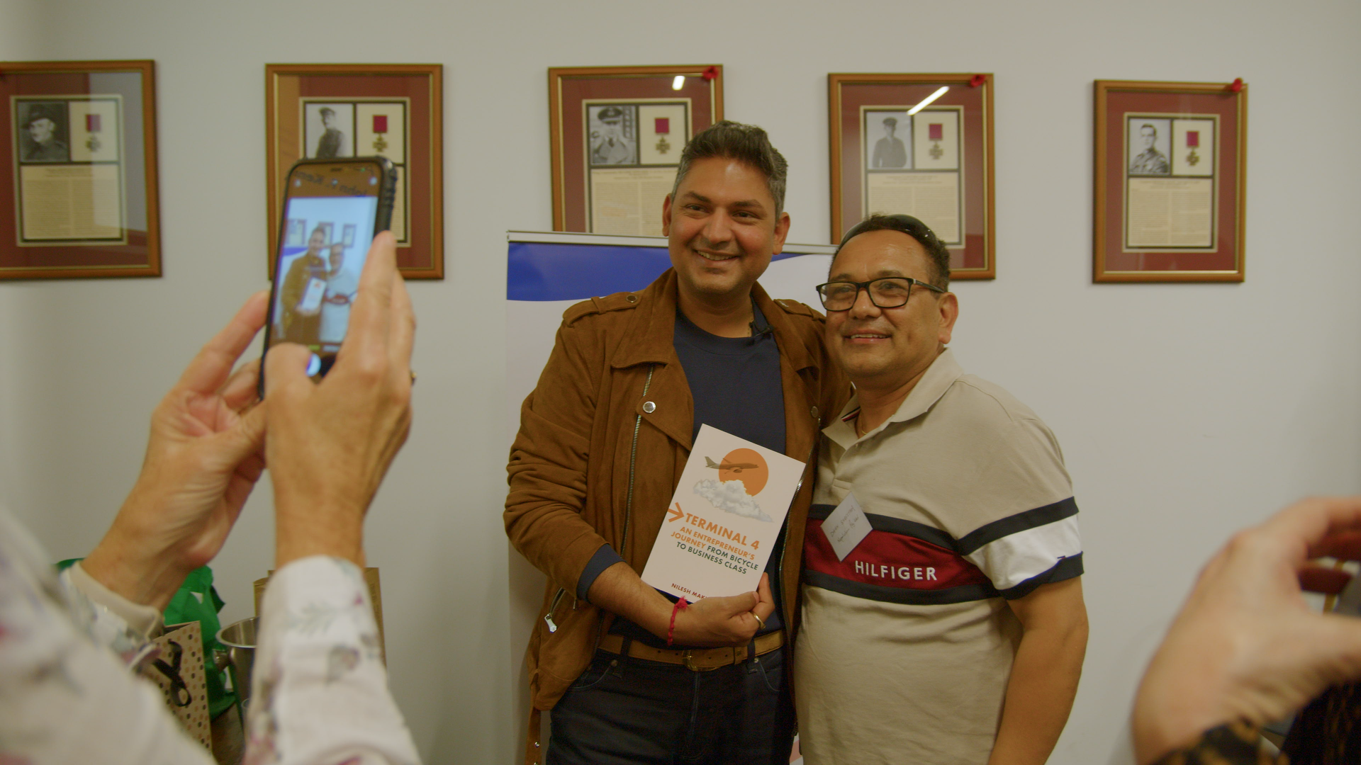 Nilesh Makwana with the winner of his book 'Terminal 4: An entrepreneur's journey from bicycle to business class"